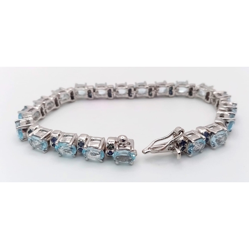 37 - An Aquamarine Gemstone Tennis Bracelet set in 925 Silver. 18cm length. 28g. Ref: HV -2177