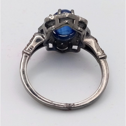 86 - A Kyanite Cabochon Diamond Ring set in 925 Silver with a Black Rhodium Coating. Weight - 3.50g. Kyan... 