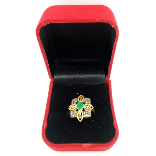 12 - A Zambian Emerald and Diamond Ring set in Gold Plated 925 Silver. Weight - 3.80g.  Emerald- 0.40ct. ... 