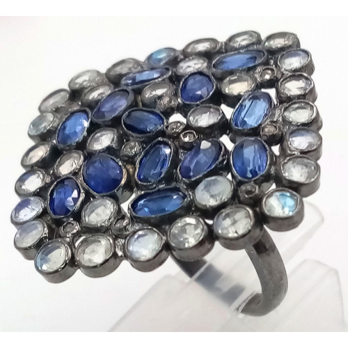 19 - A Kyanite, Moonstone & Diamond Ring set in 925 Silver with a Black Rhodium Coating. Weight - 9.39g. ... 