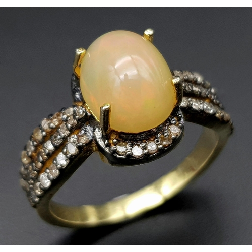 33 - An Ethiopian Opal and Diamond Ring set in Gold Plated 925 Silver. Weight - 4.40g. Opal - 1ct. Diamon... 