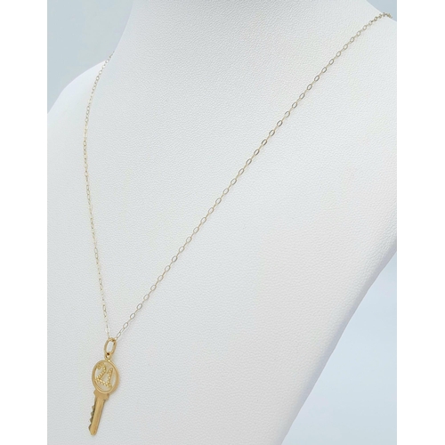 1097 - A 9k Yellow Gold 21 Pendant on a 9K Yellow Gold Disappearing Necklace. 2cm and 46cm. 1g total weight... 