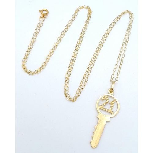 1097 - A 9k Yellow Gold 21 Pendant on a 9K Yellow Gold Disappearing Necklace. 2cm and 46cm. 1g total weight... 