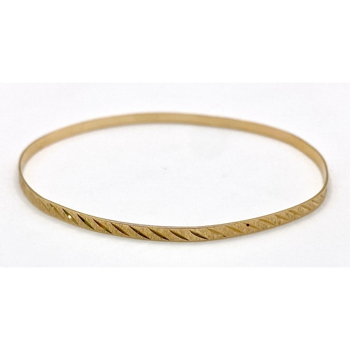 852 - A Vintage 9K Yellow Gold Bangle. 3.75g weight. 6.5cm inner diameter.