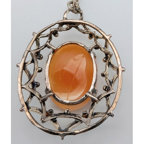 831 - A vintage sterling silver Cameo pendant on silver chain. Total weight 4.7G. Total length 47cm.