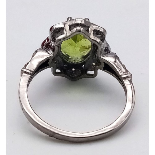 11 - A Peridot and Diamond 925 Silver Ring. Central 2.50ct oval peridot with a diamond surround - 0.20ctw... 