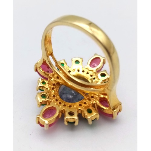 26 - A Blue Sapphire, Ruby, Emerald and Diamond Ring set in Gold Plated 925 silver. Weight - 7.40g. Blue ... 