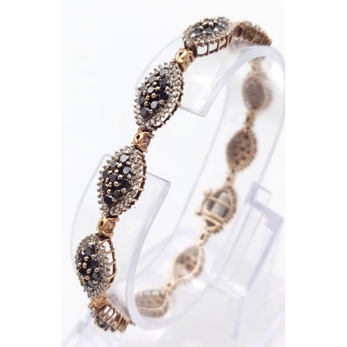 1274 - AN ATTRACTIVE 9K YELLOW GOLD BLACK AND WHITE DIAMOND BRACELET WITH SAFETY CATCH, 3.50CT APPROX DIAMO... 