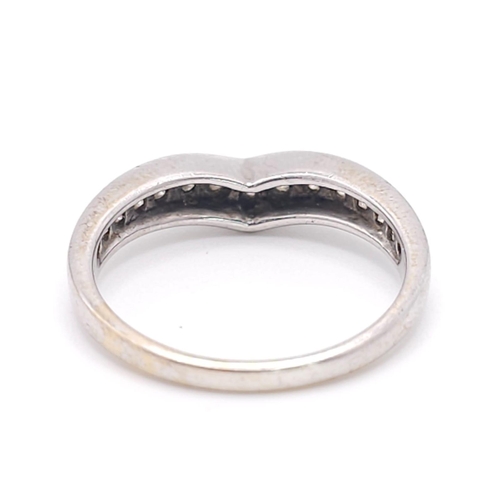 1253 - An 18K White Gold Diamond Chevron Ring. 0.35ctw. Size O. 3.4g total weight.