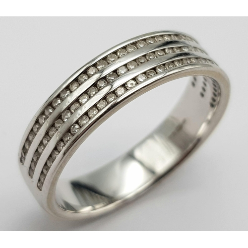 1388 - An 18K White Gold Triple Row Diamond Half Eternity Ring. 0.48ctw. Size P. 4.7g total weight.