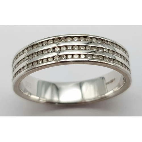 1388 - An 18K White Gold Triple Row Diamond Half Eternity Ring. 0.48ctw. Size P. 4.7g total weight.