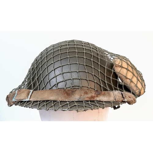 167 - WW2 British MK II Helmet with Cam Net and 1944 Dated (D-Day) Field Dressing.