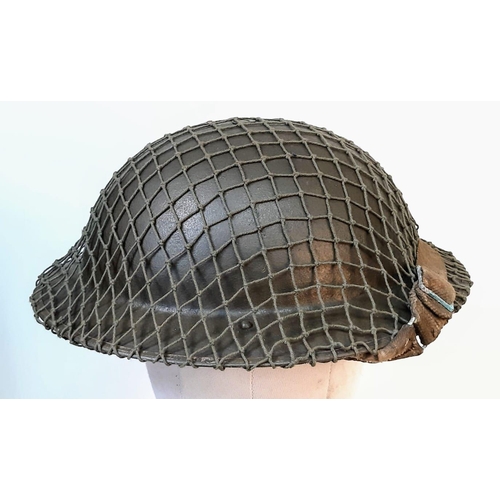 167 - WW2 British MK II Helmet with Cam Net and 1944 Dated (D-Day) Field Dressing.