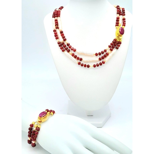 228 - A very glamorous three row necklace and bracelet set with multi-faceted rubies and large, pink, unus... 