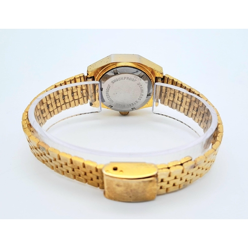 255 - A Classic Vintage Omax Ladies Mechanical Jump Watch. Gilded bracelet and case - 26mm. Gold tone dial... 