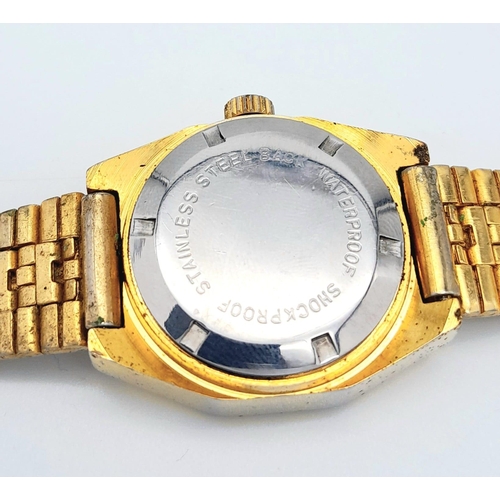 255 - A Classic Vintage Omax Ladies Mechanical Jump Watch. Gilded bracelet and case - 26mm. Gold tone dial... 