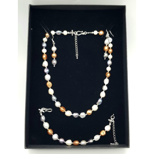 305 - A natural, multi-coloured pearl necklace, bracelet and earrings set, in a presentation box. Necklace... 