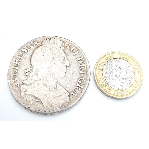 414 - A 1696 William III Silver Crown Coin. Please see photos for conditions.