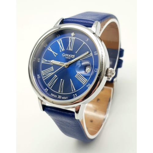 452 - A Gamages of London Quartz Ladies Watch. Blue leather strap. Stainless steel case - 37mm. Ice blue d... 