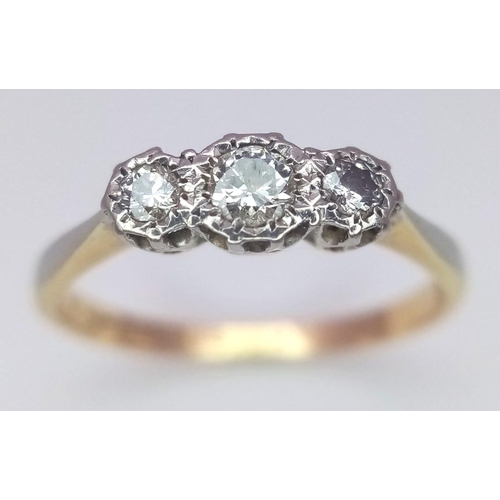 254 - An 18 K yellow gold and platinum ring with a trilogy of round cut diamonds, size: L, weight: 1.9 g.