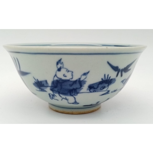 256 - A Chinese blue and white hand painted bowl decorated with children playing with birds. White porcela... 