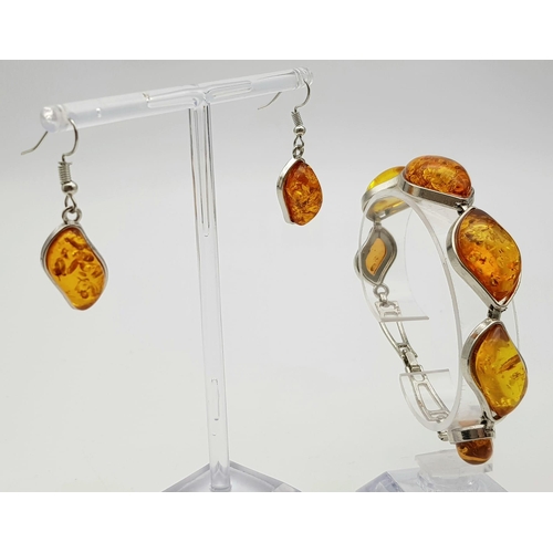 284 - An amber bracelet with matching earrings set in a presentation box, bracelet length: 20 cm, earrings... 