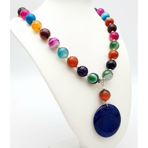 312 - A “Happy, care-free” necklace and earrings set with large (14 mm) multi-coloured banded agate beads,... 