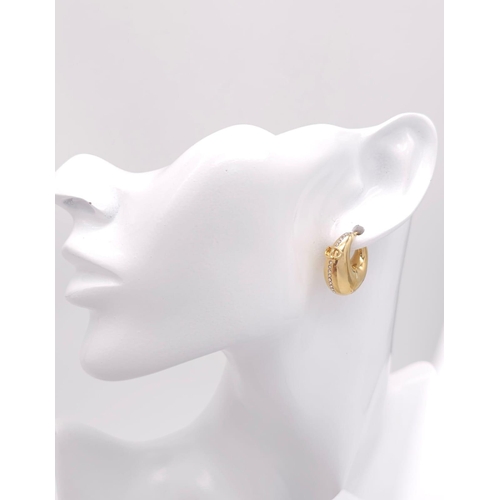 375 - A gold plated  DIOR pair of earrings with  cubic zirconia. Dimensions: 21 x 22 x 10 mm.