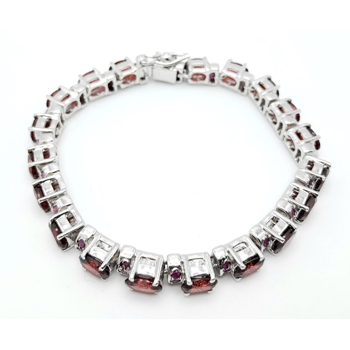 40 - A Hessonite Garnet & Madagascar, Ruby Spacer Gemstone 925 Silver Bracelet. Weight - 28.9g. 18cm leng... 