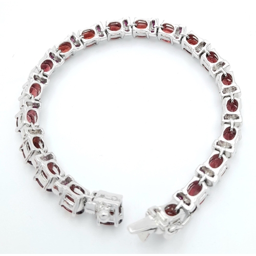 40 - A Hessonite Garnet & Madagascar, Ruby Spacer Gemstone 925 Silver Bracelet. Weight - 28.9g. 18cm leng... 