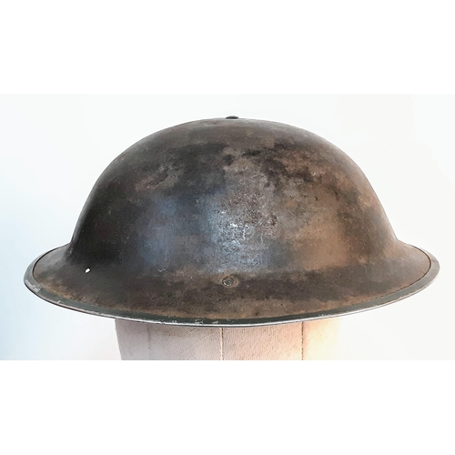 401 - WW2 South African MK II “Tommy” Helmet. The holes at the back are for a cloth nape protector cloth. ... 