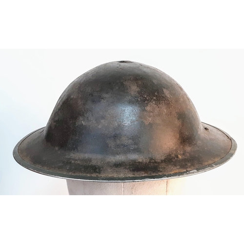 401 - WW2 South African MK II “Tommy” Helmet. The holes at the back are for a cloth nape protector cloth. ... 