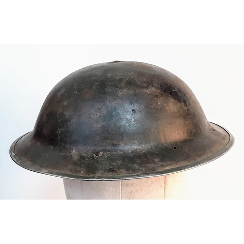 401 - WW2 South African MK II “Tommy” Helmet. The holes at the back are for a cloth nape protector cloth. ... 