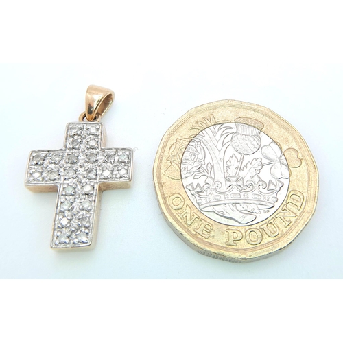 465 - A 9 K yellow gold cross studded with diamonds (0.25 carats), dimensions (with bail): 24 x 14 x 4 mm,... 