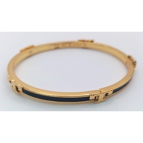 486 - A gold plated, TROY BURCH design, black enamelled bangle. Clasp not tight. Inner dimensions: 59 x 50... 