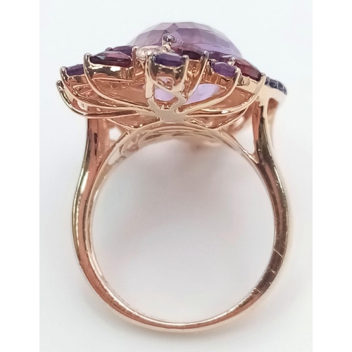 67 - A stunning LE VIAN design, 14 K rose gold ring and earrings set with large pear shaped amethysts and... 