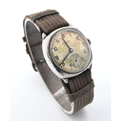 325 - A Vintage Buren (1940s) Mechanical Gents Watch. Textile strap. Stainless steel case - 30mm. Patinaed... 