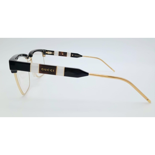 332 - A GUCCI pair of glasses, gold plated in parts with mother of pearl highlights. Very stylish!