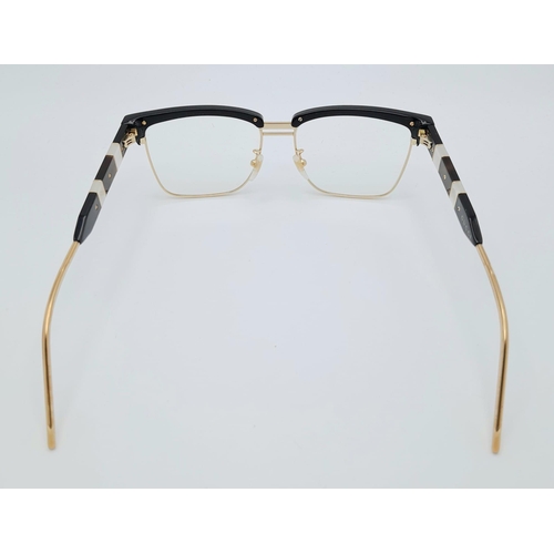 332 - A GUCCI pair of glasses, gold plated in parts with mother of pearl highlights. Very stylish!