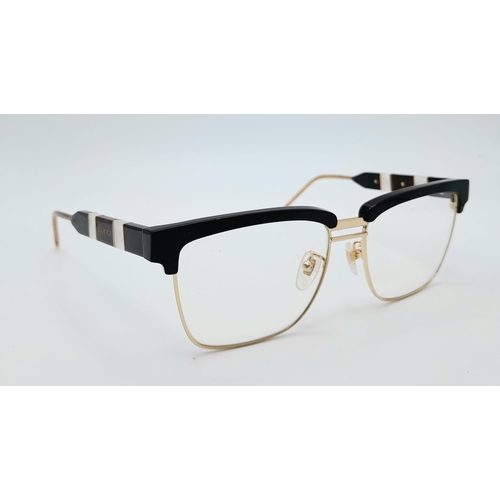 332 - A GUCCI pair of glasses, gold plated in parts with mother of pearl highlights. Very stylish!