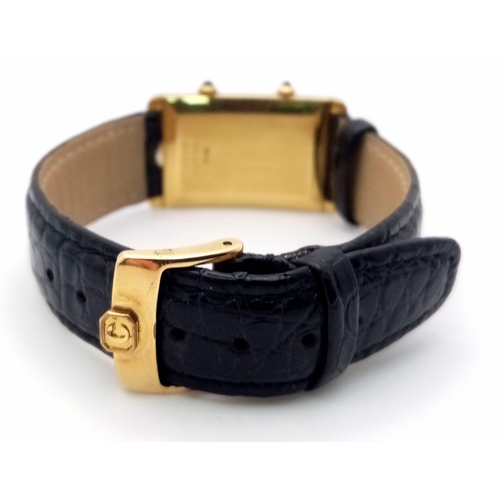 102 - A Chopard 18K Gold Home Time (Dual Time) Gents Watch. Black leather strap. 18K gold rectangular case... 