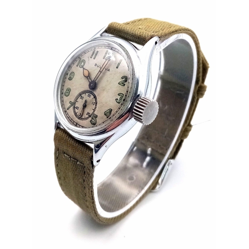 206 - A Vintage (1940s) Military Style Bulova Mechanical Gents Watch. Green textile strap. Stainless steel... 