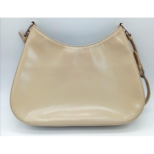 347 - A Prada Cream Patent Leather Shoulder Bag. Adjustable shoulder strap. Prada branded textile interior... 