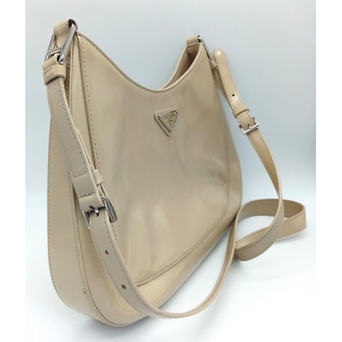 347 - A Prada Cream Patent Leather Shoulder Bag. Adjustable shoulder strap. Prada branded textile interior... 