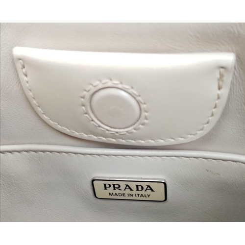 347 - A Prada Cream Patent Leather Shoulder Bag. Adjustable shoulder strap. Prada branded textile interior... 