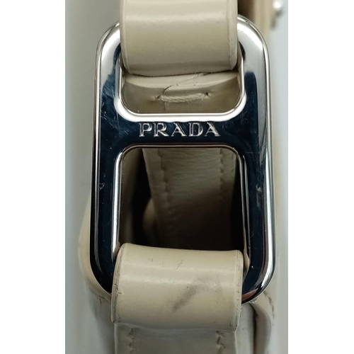 347 - A Prada Cream Patent Leather Shoulder Bag. Adjustable shoulder strap. Prada branded textile interior... 