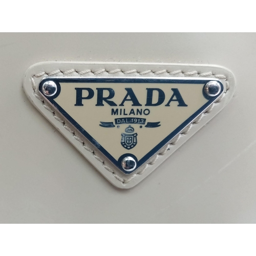 347 - A Prada Cream Patent Leather Shoulder Bag. Adjustable shoulder strap. Prada branded textile interior... 