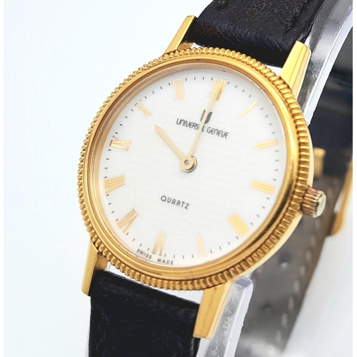 354 - A Gold Plated Universal Quartz Ladies Watch. Black leather strap. Gold plated case - 23mm. White dia... 