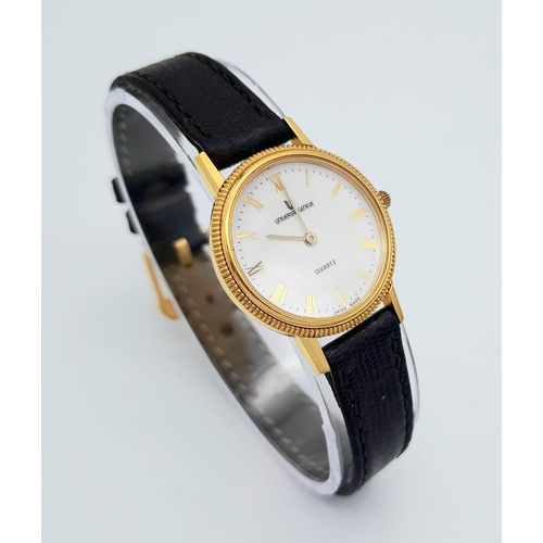 354 - A Gold Plated Universal Quartz Ladies Watch. Black leather strap. Gold plated case - 23mm. White dia... 