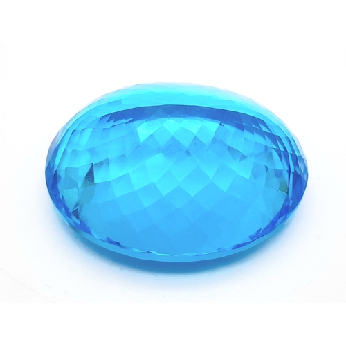 361 - A large (162.81 carats), oval cut natural topaz, with vivid sky blue uniform colouration, excellent ... 